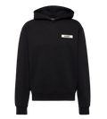 Black hoodie with a small white logo on a light gray background