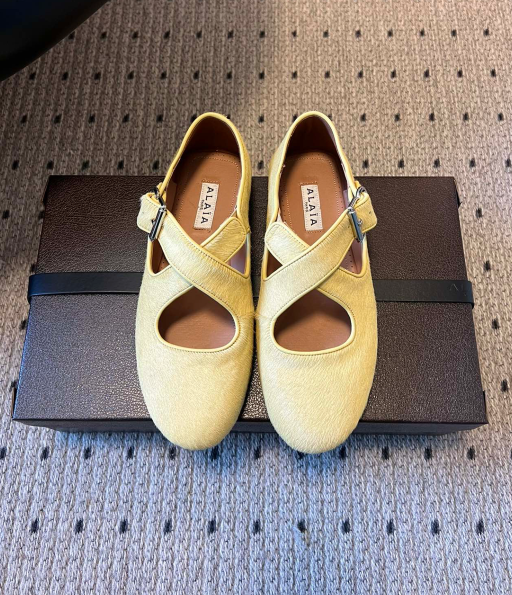 ALAÏA LEMONADE CRISS CROSS BALLET FLATS IN HAIRCALF