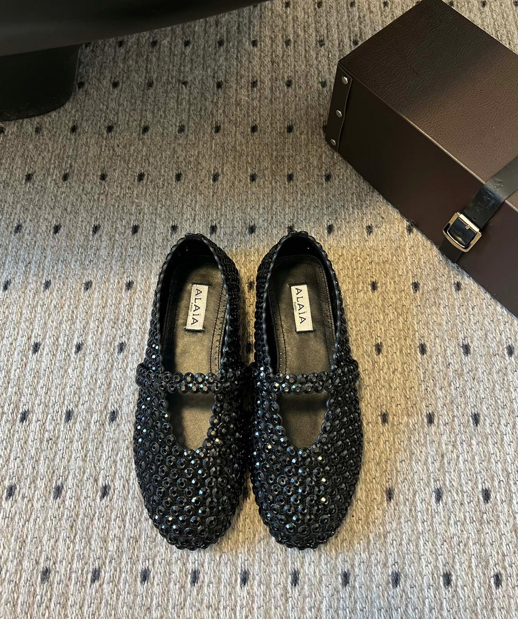 ALAÏA EMBELLISHED BALLET FLAT SHOES IN BLACK