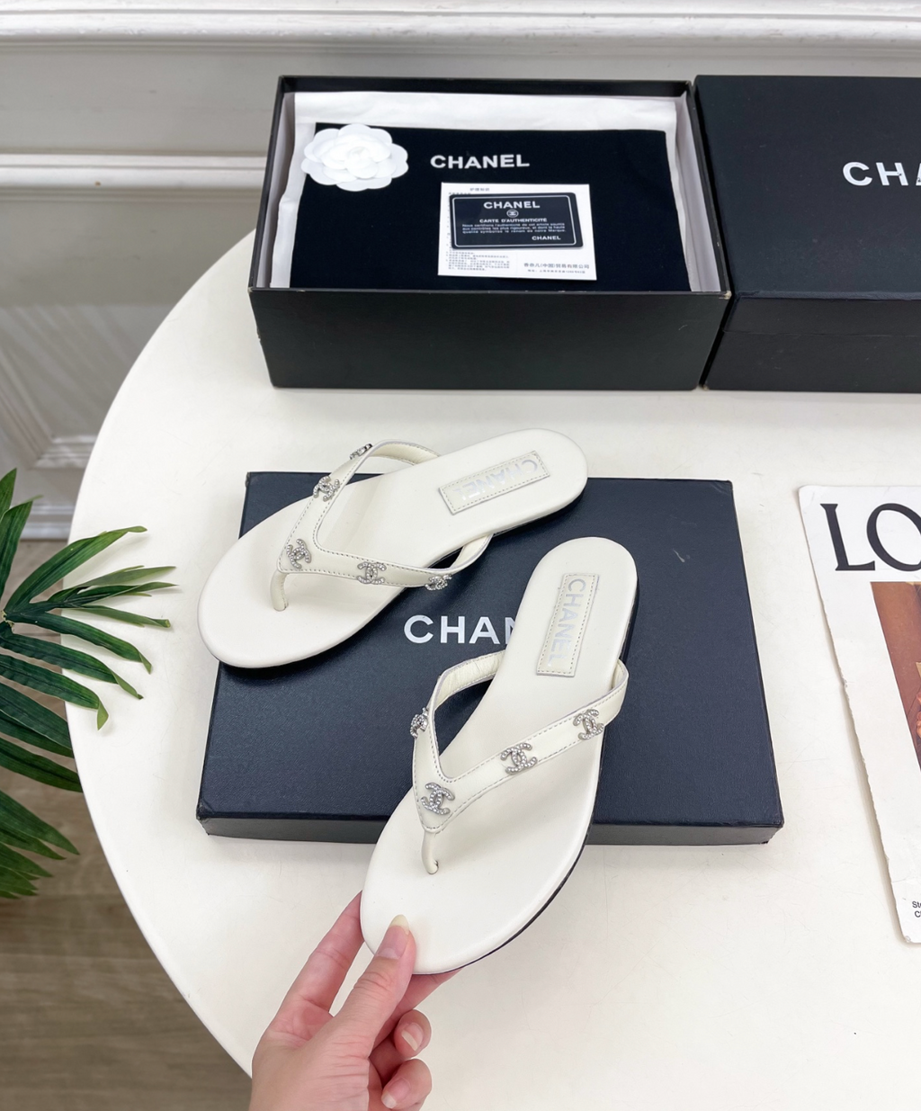 CHANEL White leather rhinestone thong sandals