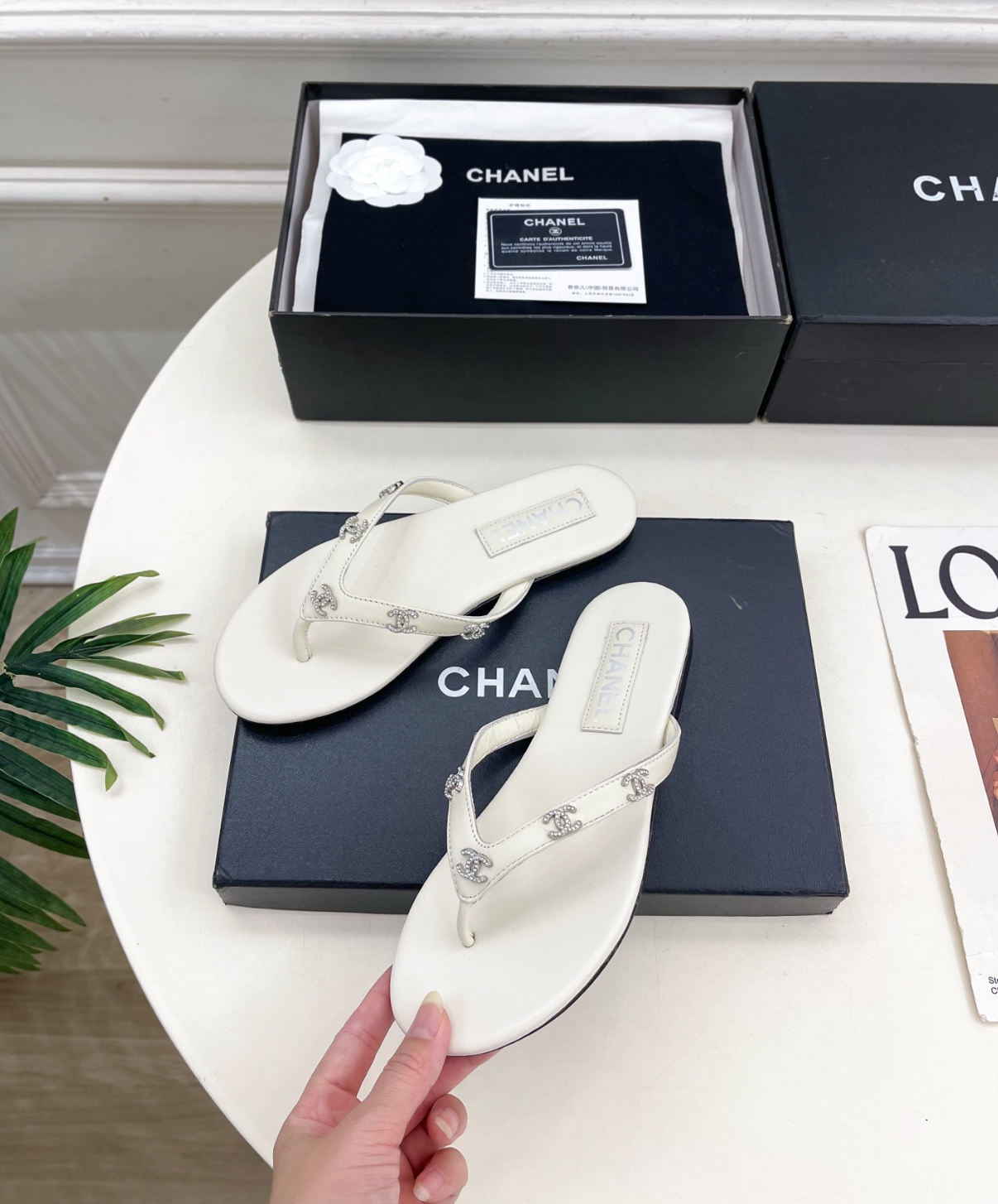 CHANEL White leather rhinestone thong sandals
