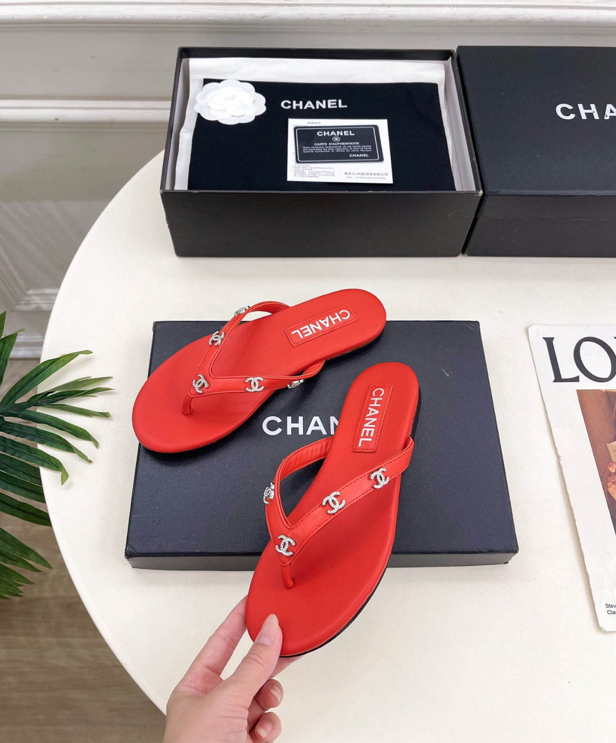 CHANEL Red leather rhinestone thong sandals